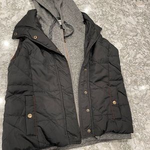 Black vest with attached grey hoodie